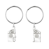 A pair of house keychains